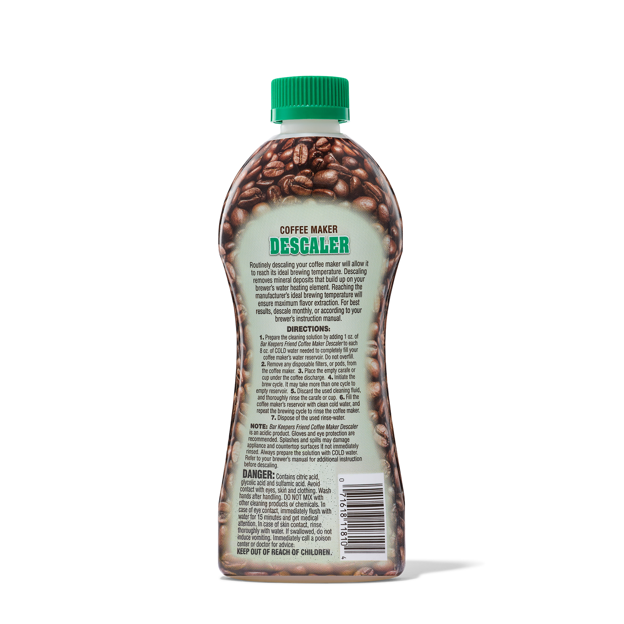 Bottle of coffee maker descaler with instructions and warnings on the label, featuring coffee beans design and a green cap.