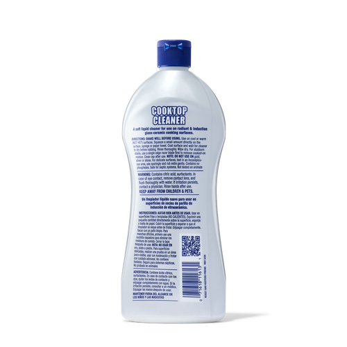 Bottle of cooktop cleaner with detailed usage and safety instructions on the back label.